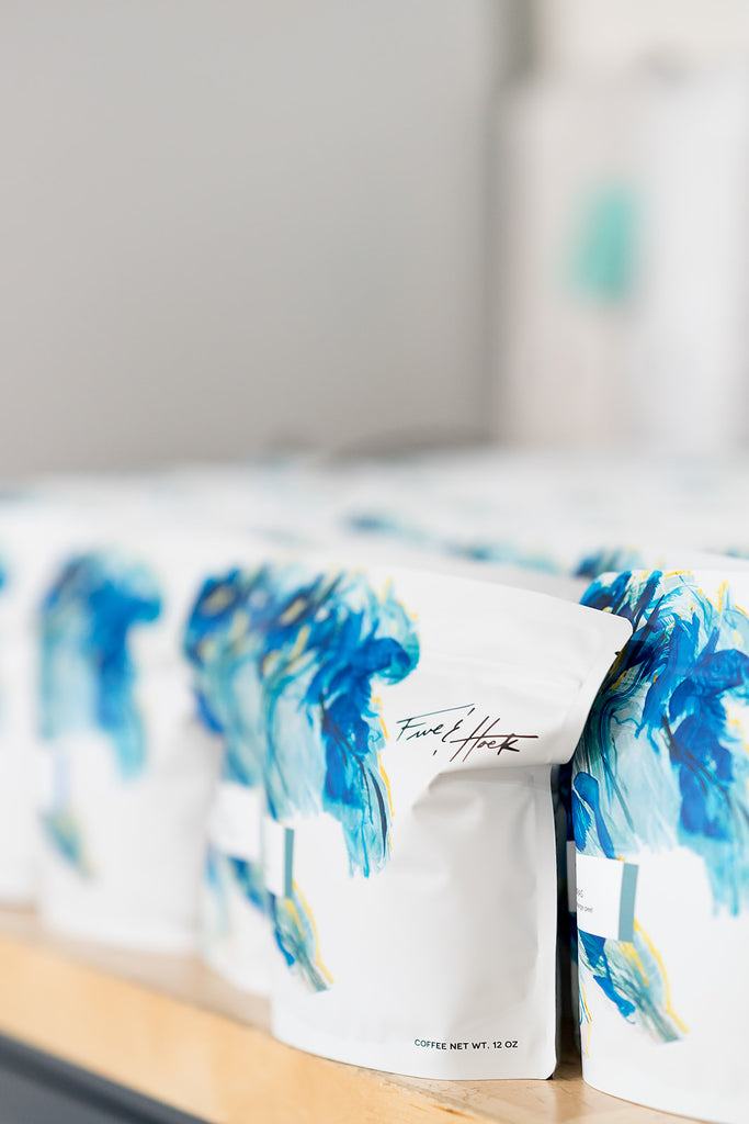 rows upon rows of our standard 12 oz. coffee bags ready to go out into the wild. Exceptional decaf, ethically sourced direct trade coffee, organic coffee roasted on site at our locations in Wheaton IL and Knoxville TN.